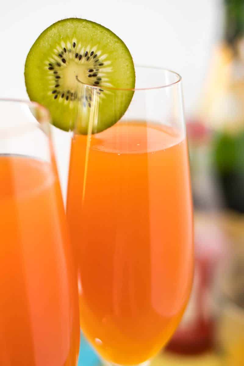 Tropical Mimosas - The classic brunch drink, given a tropical twist with the addition of mango, pineapple, and a splash of grenadine.