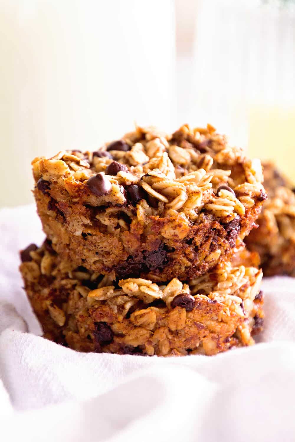 Baked Oatmeal cups with chocolate and banana in a stack