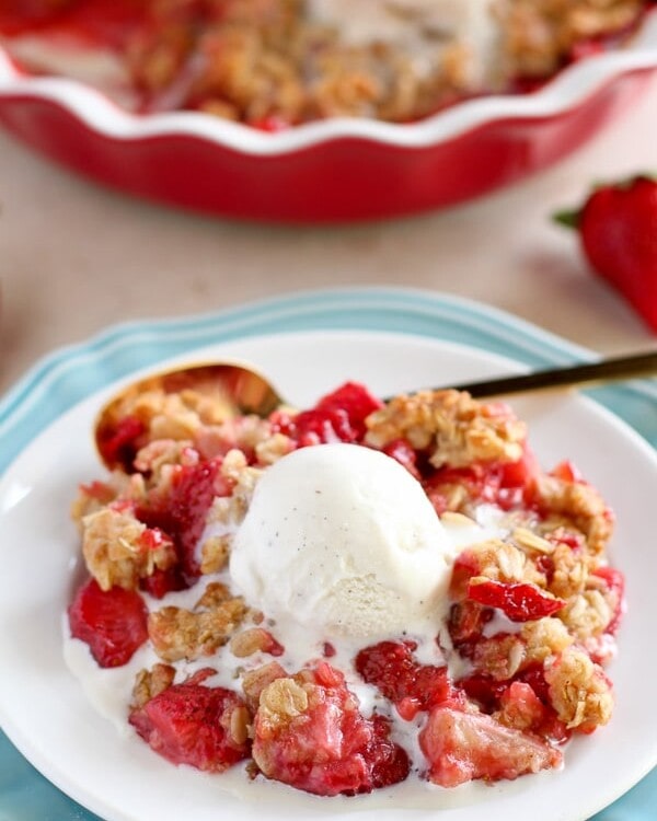 Easy Strawberry Crisp - Sweet and juicy strawberries topped with a buttery brown sugar oat crumble.