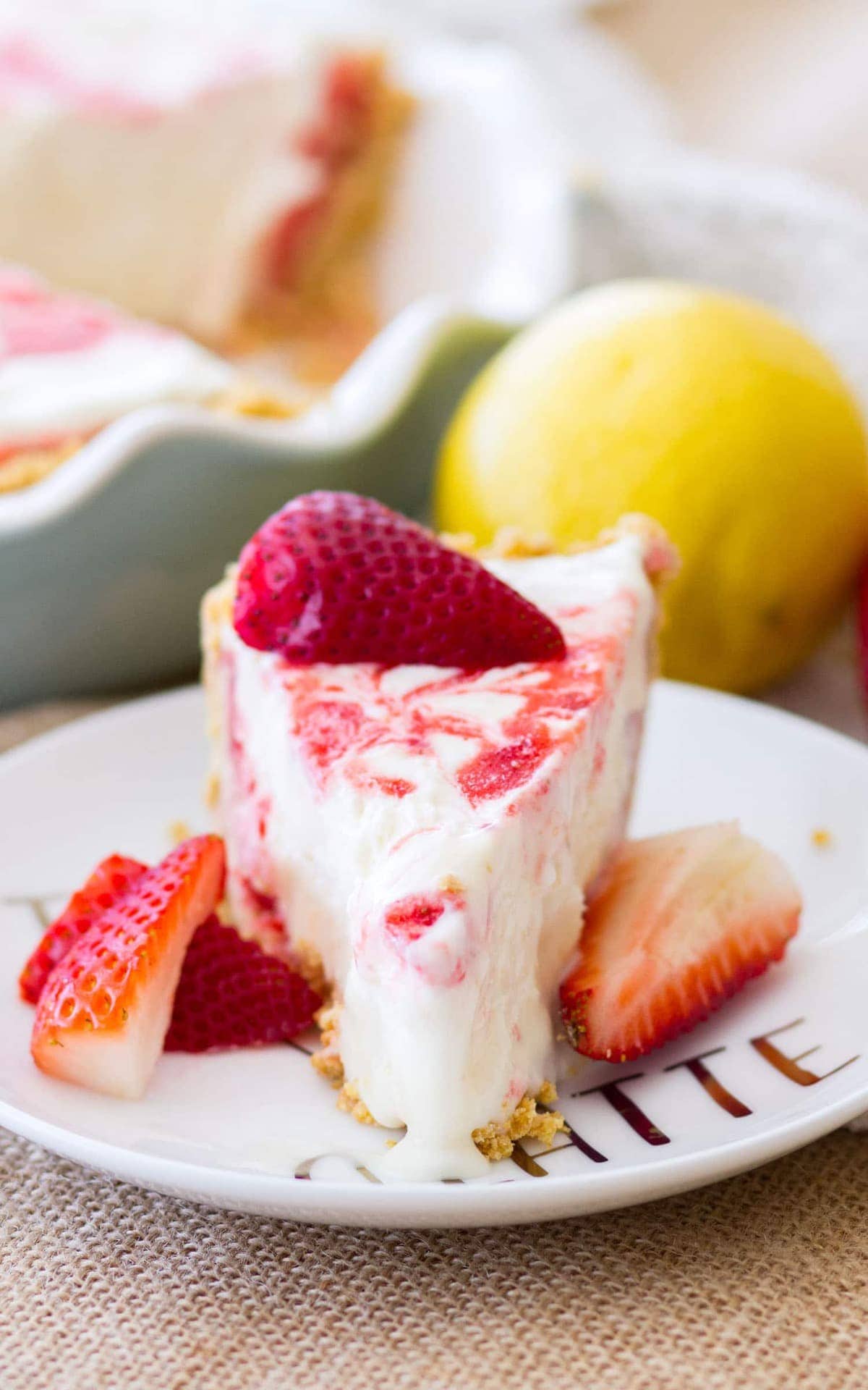 A slice of Strawberry Lemonade Pie. This icebox pie is the perfect no-bake summer dessert!