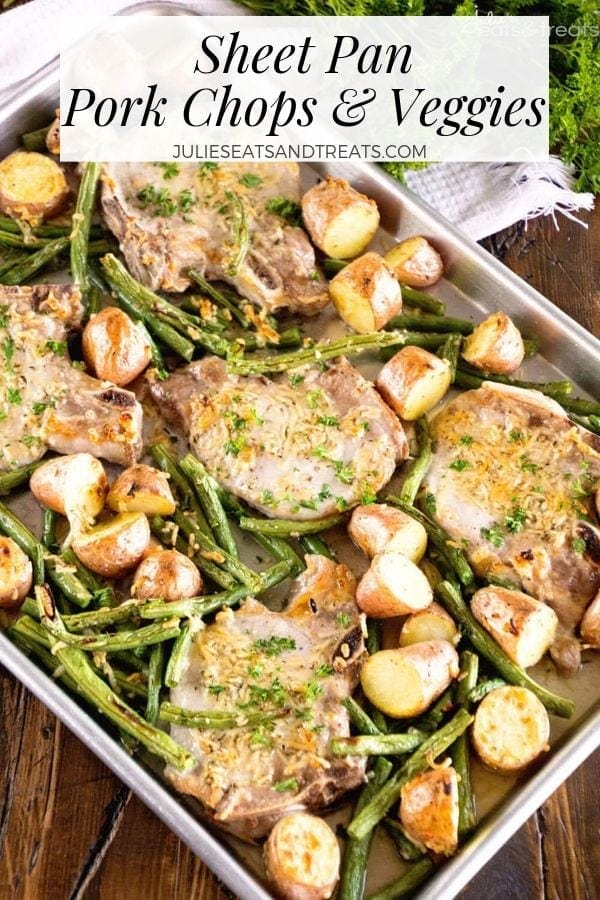 Sheet pan pork chops and veggies on a baking sheet.