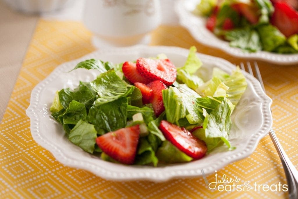 Strawberry Romaine Salad with the most amazing Italian orange dressing! Full of strawberries candied nuts, it is the most delicious salad ever!