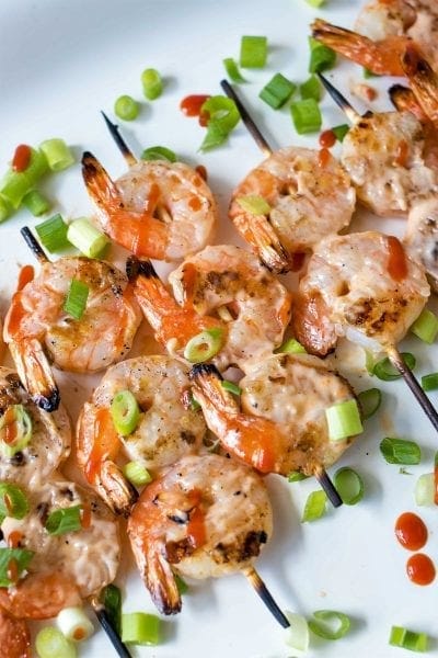 Grilled Bang Bang Shrimp Skewers - Grilled shrimp skewers covered in a spicy, creamy, sweet chili sauce. Perfect for the summer barbecues!