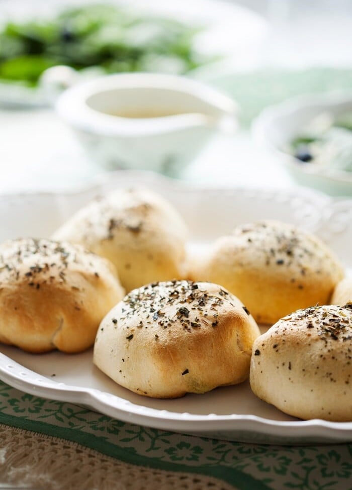 Six chicken pesto pillows on a white tray