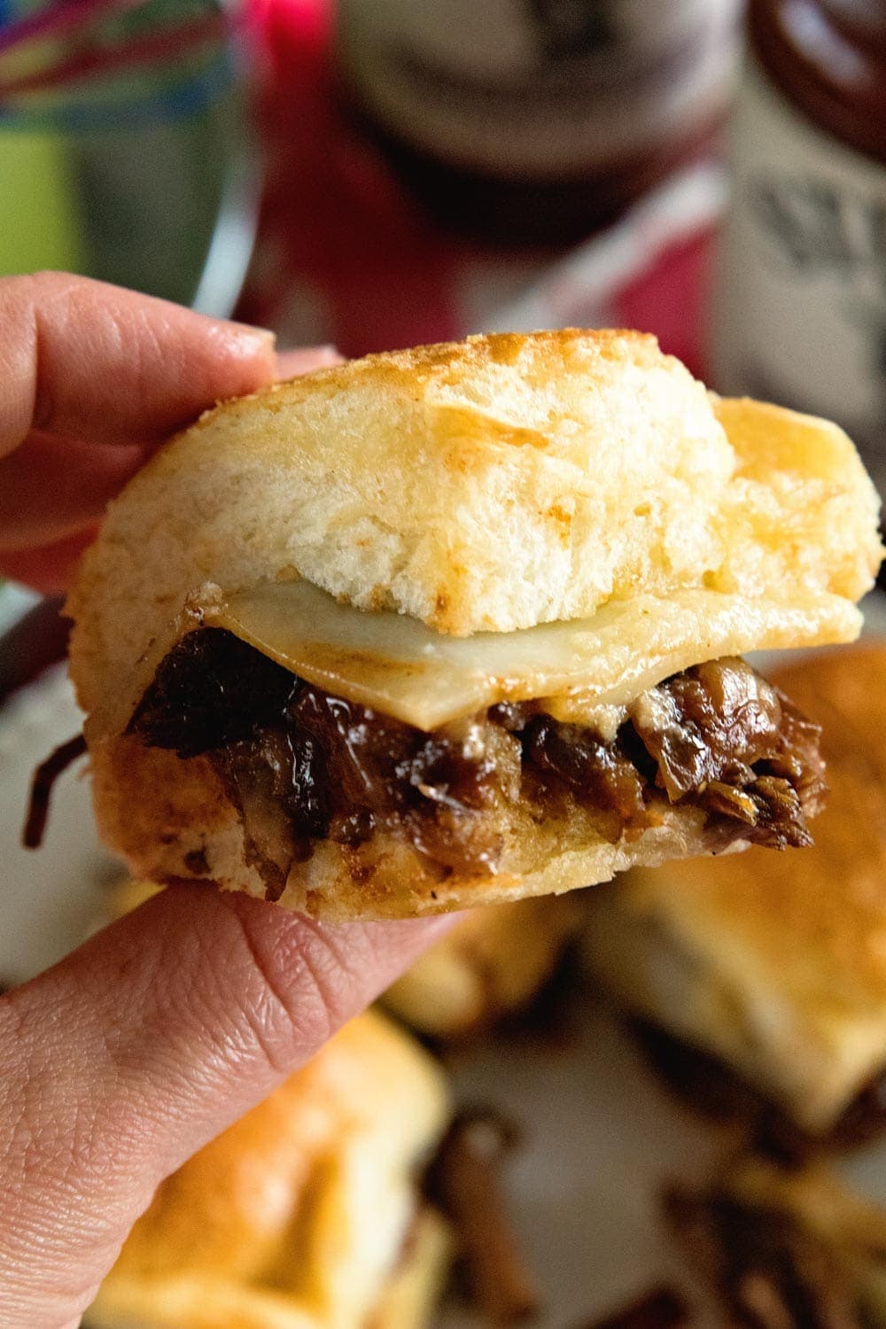 Instant Pot Brisket Sliders with Caramelized Onions ~ Tender, Shredded Brisket Cooked in Your Instant Pot. Stuffed into Sliders Then Topped with Caramelized Onions and Cheese! Perfect Finger Food for Parties!