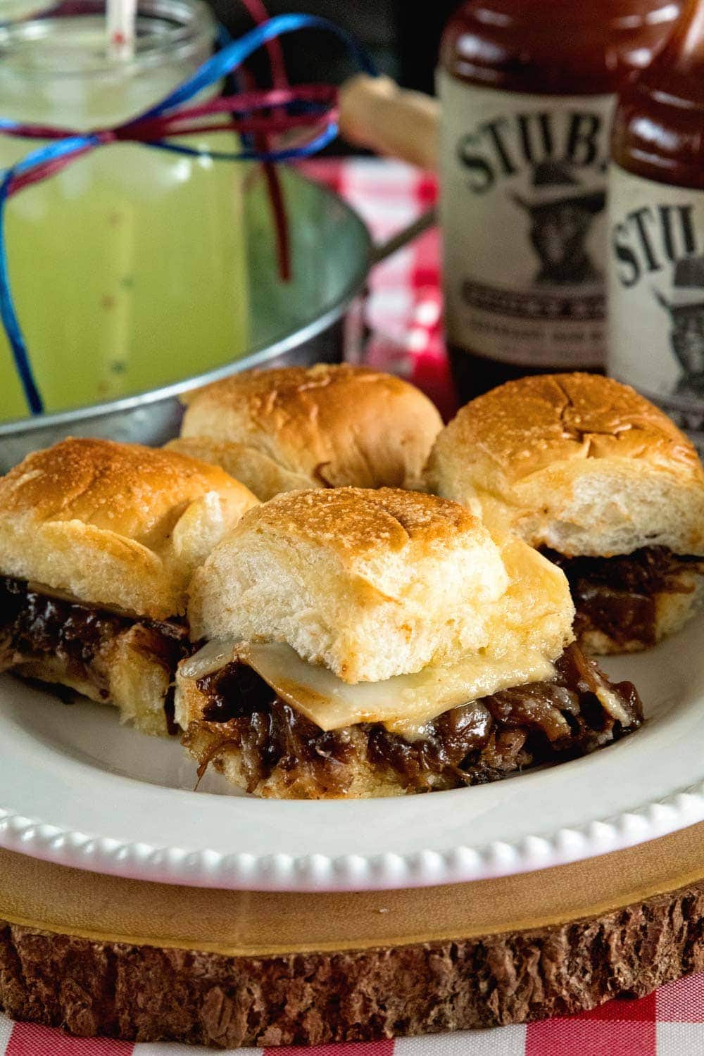 Instant Pot Brisket Sliders with Caramelized Onions ~ Tender, Shredded Brisket Cooked in Your Instant Pot. Stuffed into Sliders Then Topped with Caramelized Onions and Cheese! Perfect Finger Food for Parties!