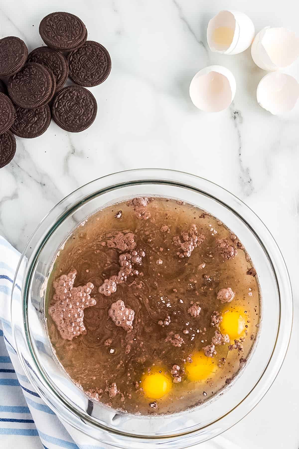 Glass bowl with ingredients to make chocolate cake