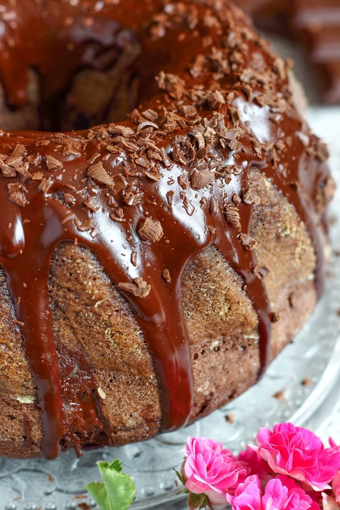 Chocolate Bundt Cake. Wow your guests with this pretty and easy dessert! It’s covered with chocolate glaze, chocolate shavings and has chocolate pieces inside!