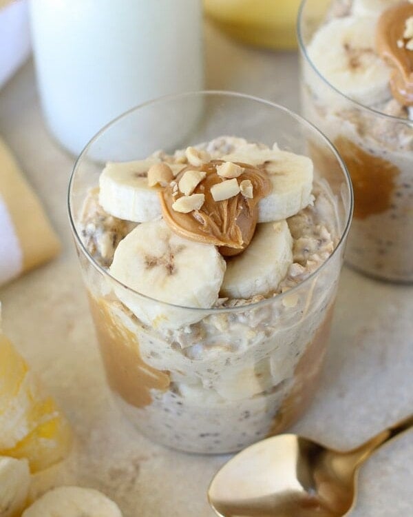 Peanut Butter Banana Overnight Oats in two clear cups