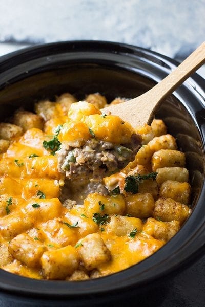 This Slow Cooker Bacon Cheeseburger Tater Tot Casserole is a fun twist on a classic. It's made completely from scratch with no canned soup.