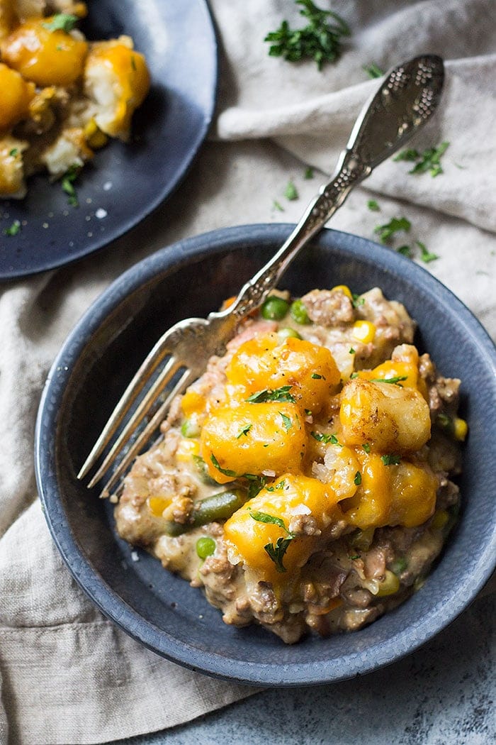This Slow Cooker Bacon Cheeseburger Tater Tot Casserole is a fun twist on a classic. It's made completely from scratch with no canned soup.