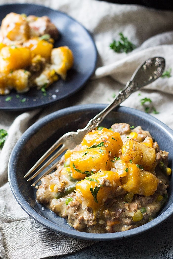 This Slow Cooker Bacon Cheeseburger Tater Tot Casserole is a fun twist on a classic. It's made completely from scratch with no canned soup.