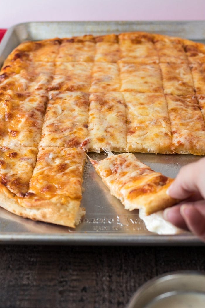 Pizza loaded with four cheese! Perfect for Friday night pizza parties!