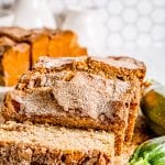 Zucchini Bread that's sliced and starting to lie down on cutting board