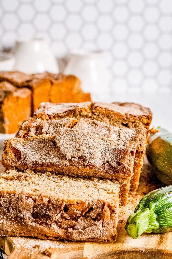 Zucchini Bread that's sliced and starting to lie down on cutting board