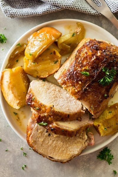 This Maple Pork Loin with Apples and Onions is an easy weeknight meal that feels more like a holiday meal! It's tender, juicy and full of flavor!