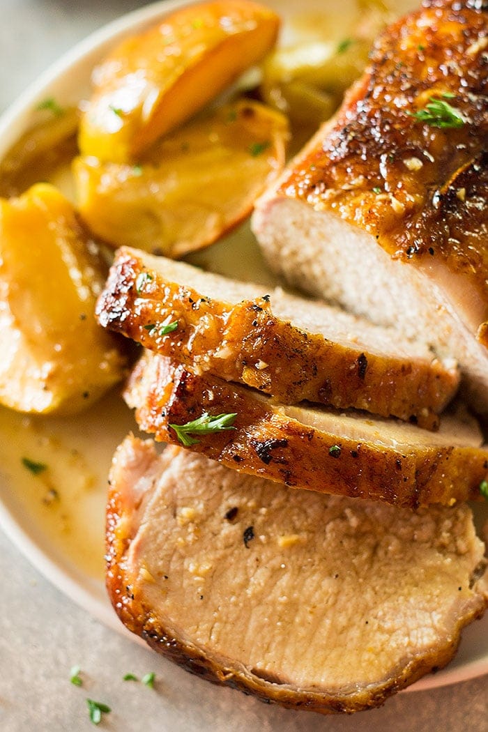 This Maple Pork Loin with Apples and Onions is an easy weeknight meal that feels more like a holiday meal! It's tender, juicy and full of flavor!