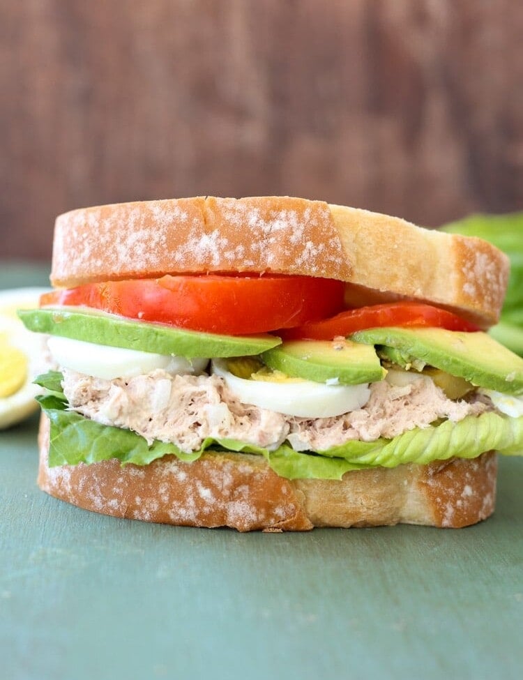 Tuna Avocado and Egg Sandwich with tomato slices