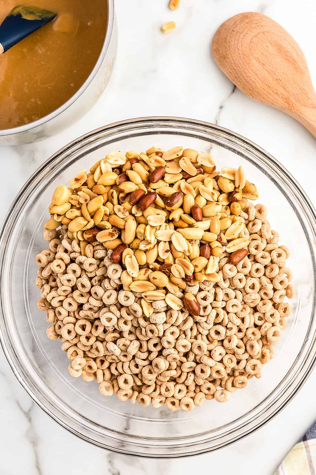 Cheerios and peanuts in glass bowl