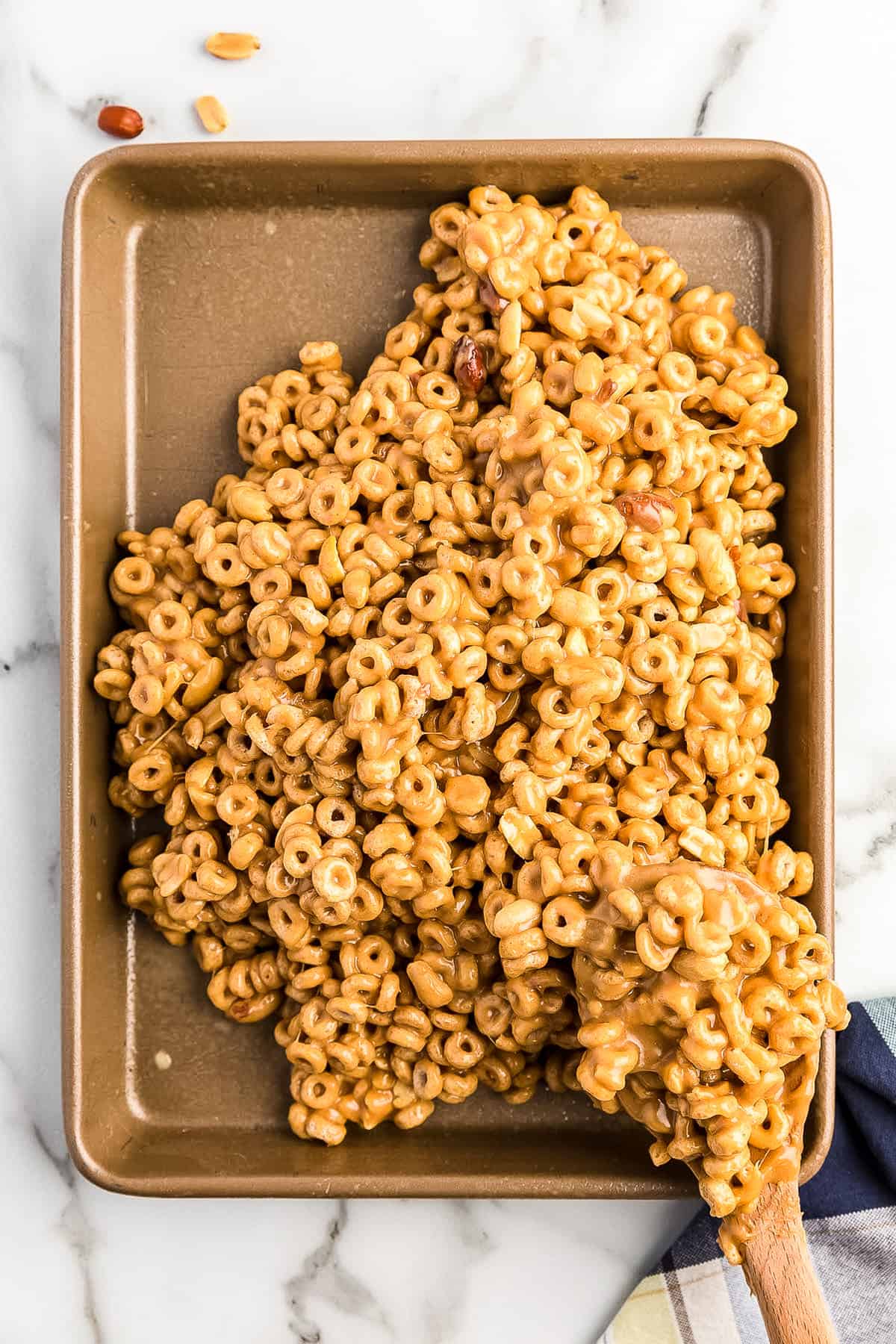 Peanut Butter Cheerio mixture in pan