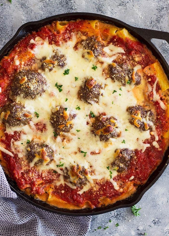 Cheesy Italian Pasta and Meatballs is pure comfort food! Tender and juicy meatballs baked in an easy homemade marinara sauce and cheesy pasta for the perfect meatball pasta!