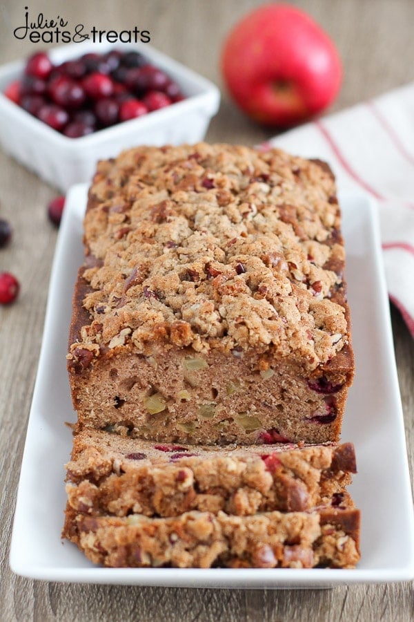 Apple Cranberry Bread - A cinnamon spiced quick bread filled with apples and fresh cranberries and topped with a pecan streusel.