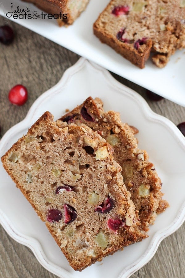 Apple Cranberry Bread - A cinnamon spiced quick bread filled with apples and fresh cranberries and topped with a pecan streusel.