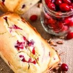 Cream Cheese Cranberry Bread Loaf and a jar of cranberries