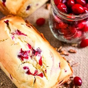 Cream Cheese Cranberry Bread Loaf and a jar of cranberries