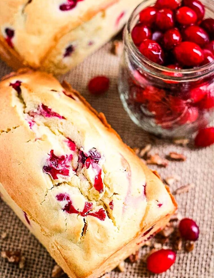 Cream Cheese Cranberry Bread Loaf and a jar of cranberries