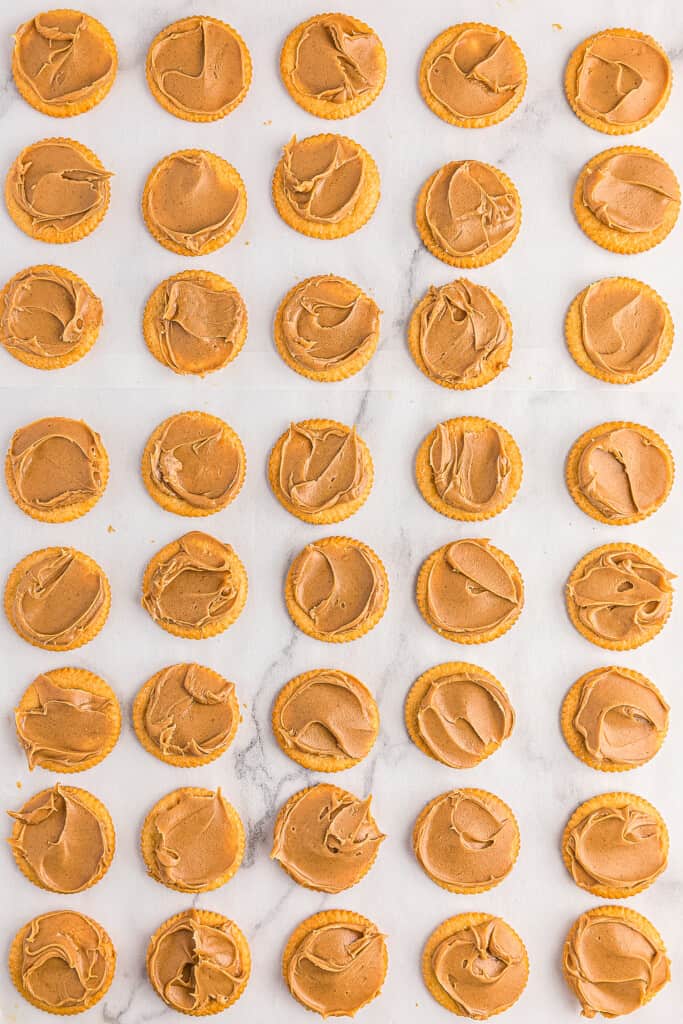 Overhead image of Ritz cracker with peanut butter on top