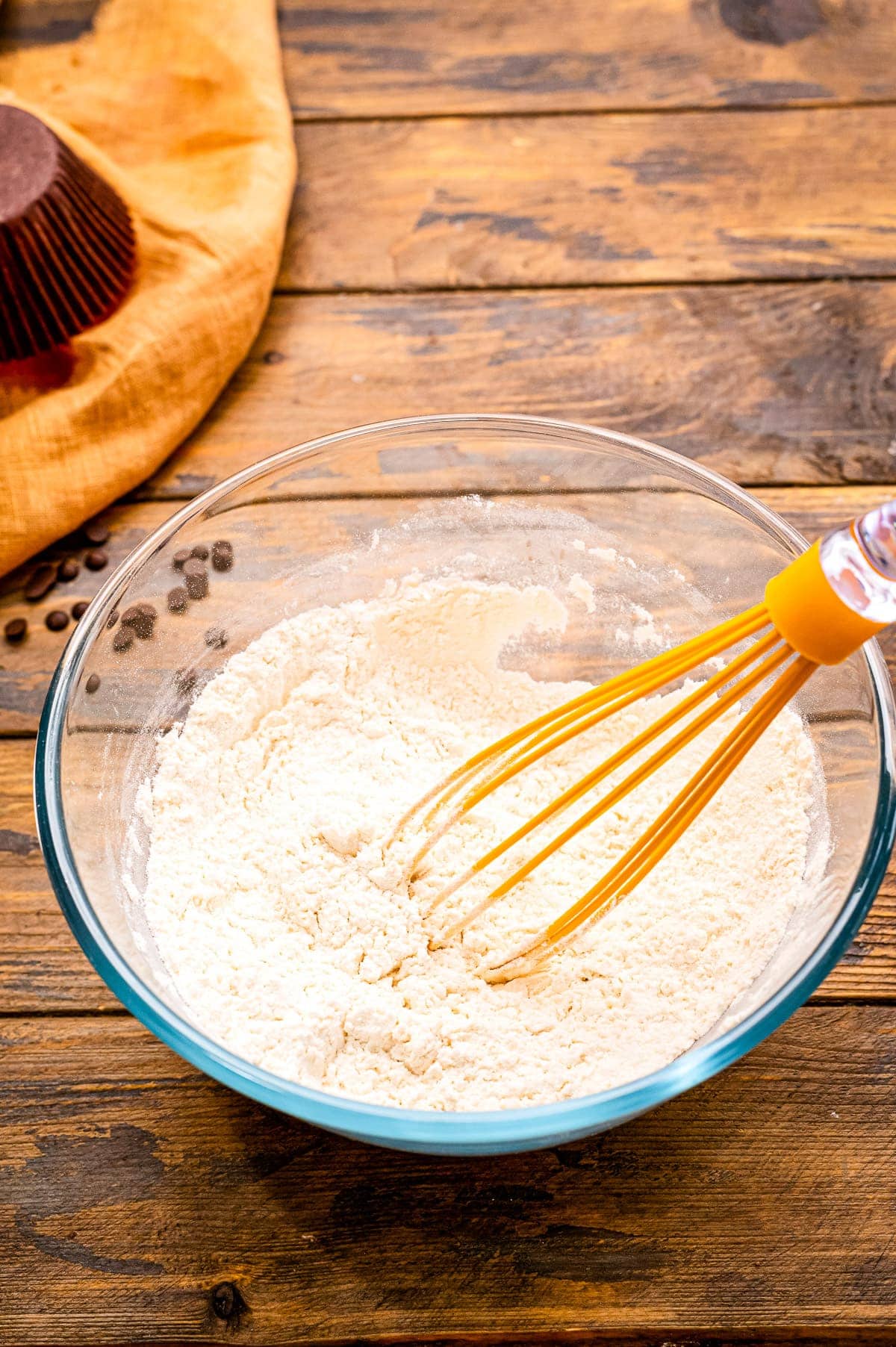 Banana Chocolate Chip Muffins ingredients with whisk sitting in bowl