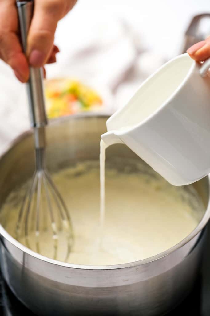 Pour milk into a saucepan with sauce