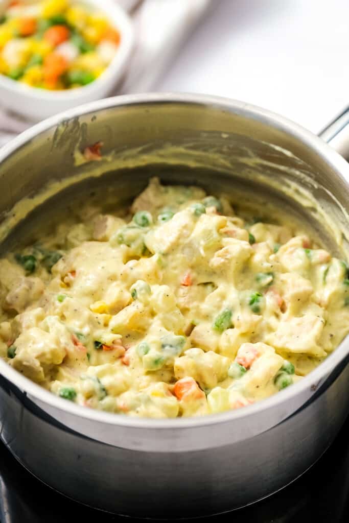 Saucepan with creamy vegetable mixture