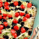 Easy taco dip in a square blue baking dish