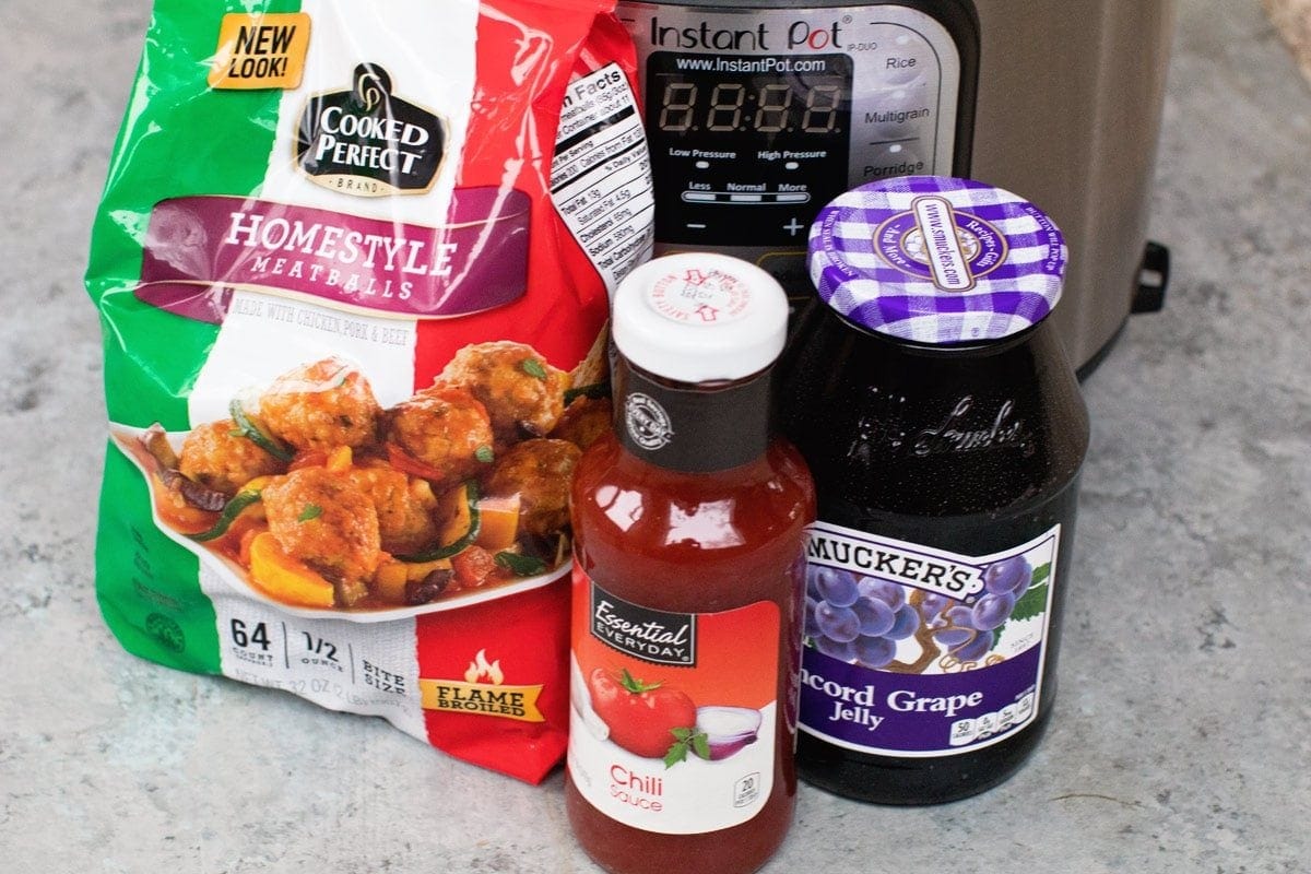 Ingredients to make grape jelly meatballs with Instant Pot in background