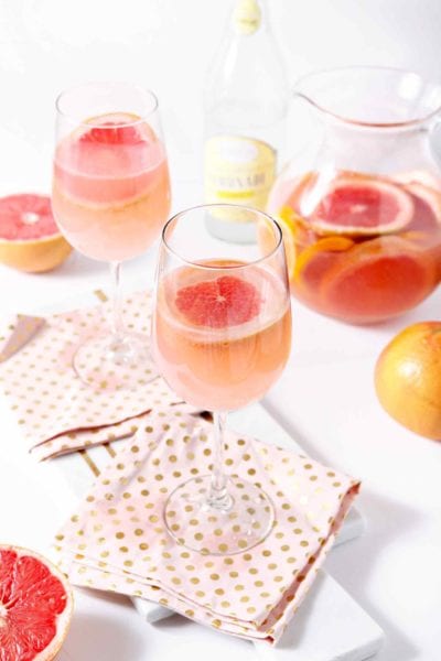 Celebrate seasonal produce by mixing this slightly sweet, yet delightfully tart Sparkling Grapefruit Sangria! Freshly squeezed pink grapefruit juice serves as the base of this cocktail, then a bottle of sauvignon blanc is added, along with Meyer lemon, blood orange and grapefruit slices. Chill before serving. Top individual glasses of sangria with Sprouts Farmers Market Sparkling Lemonade. Enjoy this sweet citrus goodness all winter long.