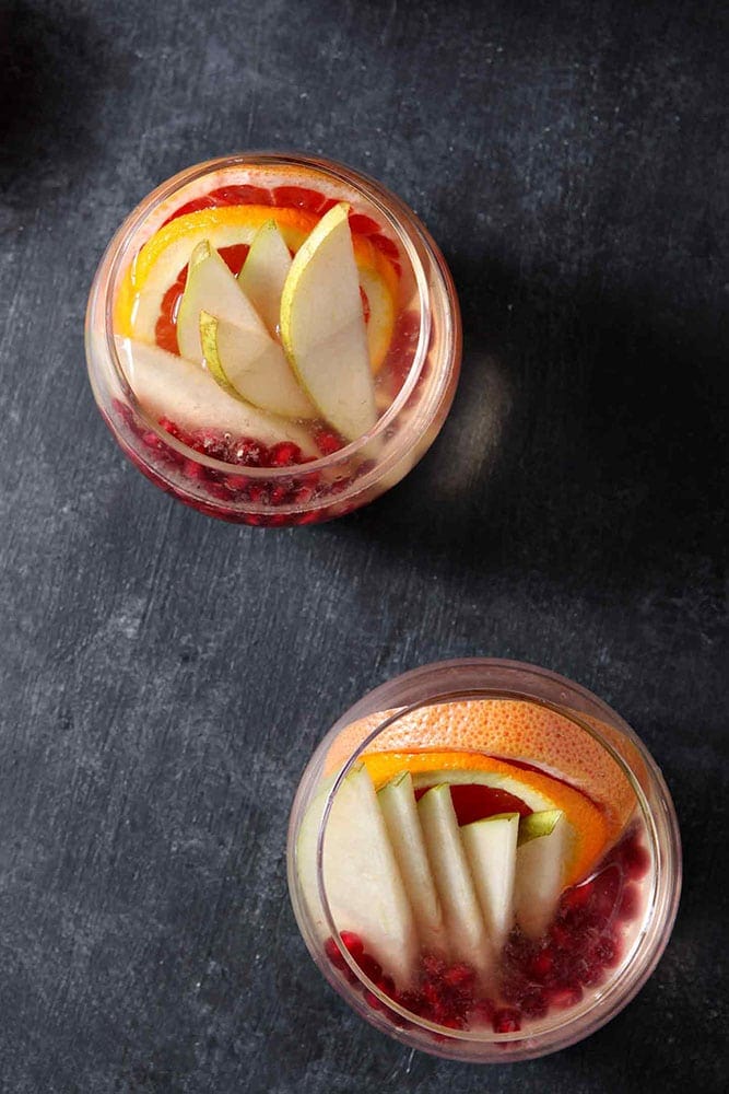 Full of pink grapefruit, cara cara or blood oranges, pears and pomegranates, Winter Sangria is bursting with flavor.