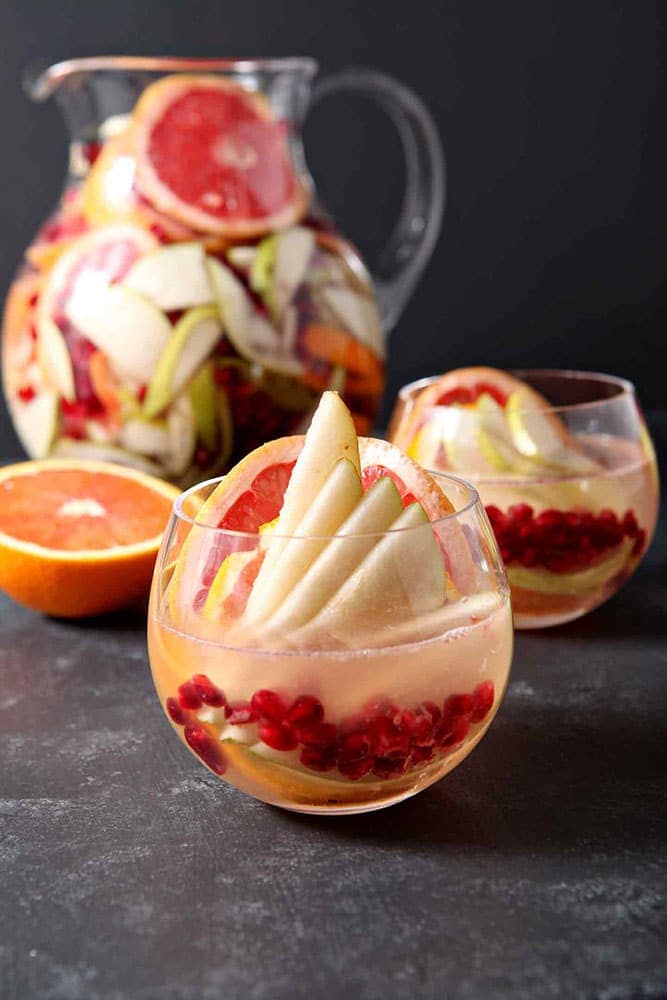 Full of pink grapefruit, cara cara or blood oranges, pears and pomegranates, Winter Sangria is bursting with flavor.