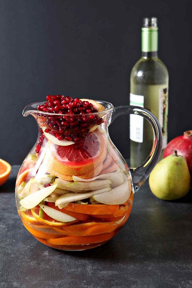 Full of pink grapefruit, cara cara or blood oranges, pears and pomegranates, Winter Sangria is bursting with flavor.