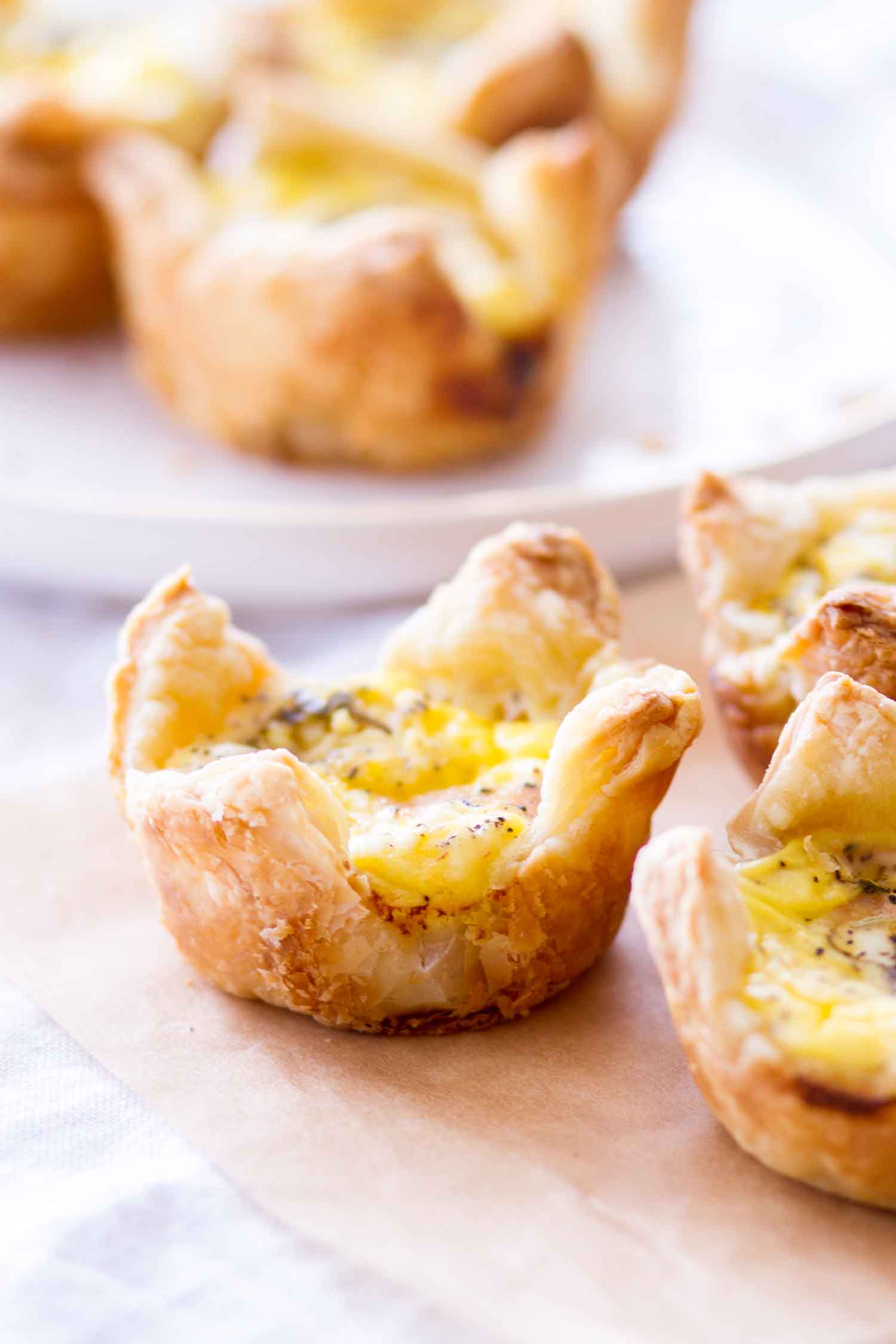 side view baked cheddar and ham quiche cups