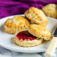 Classic English Scones - These deliciously fluffy scones are perfect served warm or cold with clotted cream and jam. Pair with your morning cup of tea for an indulgent breakfast!