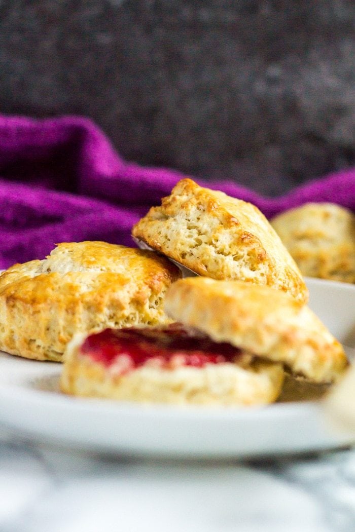 Classic English Scones - These deliciously fluffy scones are perfect served warm or cold with clotted cream and jam. Pair with your morning cup of tea for an indulgent breakfast!