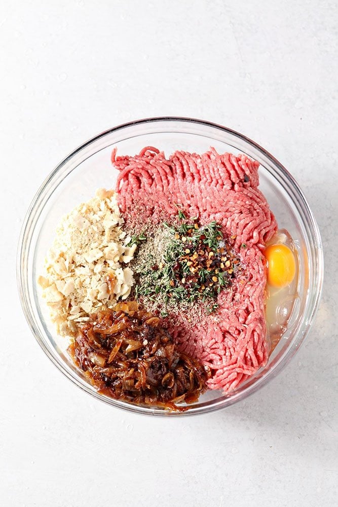 French Onion Meatloaf ingredients together in a glass bowl, ready to be mixed together to make the meatloaf