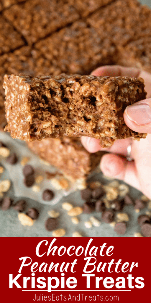 A hand holding a chocolate peanut butter rice krispie treat with a bite out of it