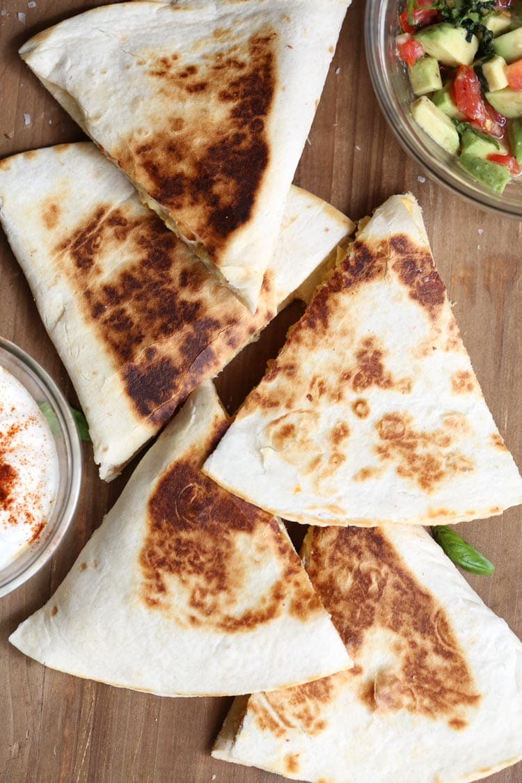 breakfast quesadillas on a board.