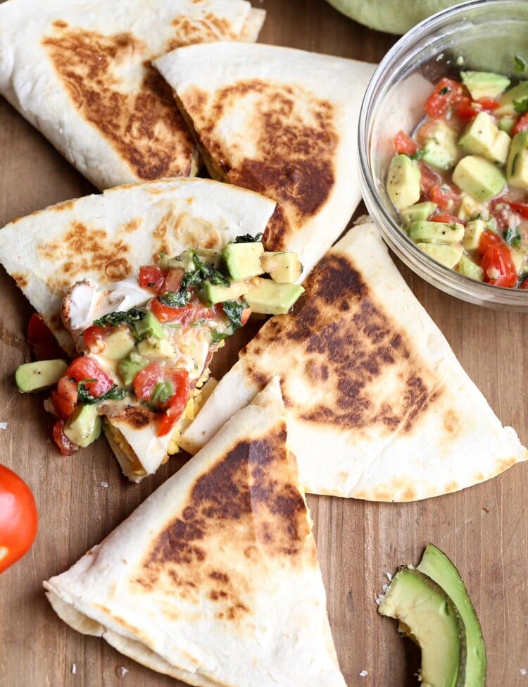 Mexican breakfast quesadillas with avocado salsa in a clear glass bowl