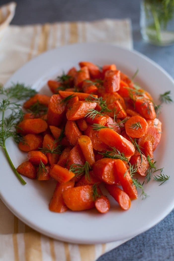 Roasted Carrots with Dill on white plate