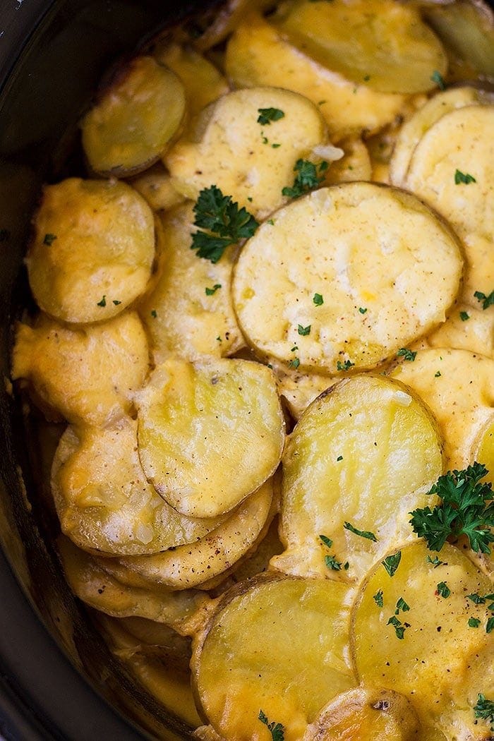 Top down view of Crock Pot Au Gratin Potatoes in a slow cooker. 