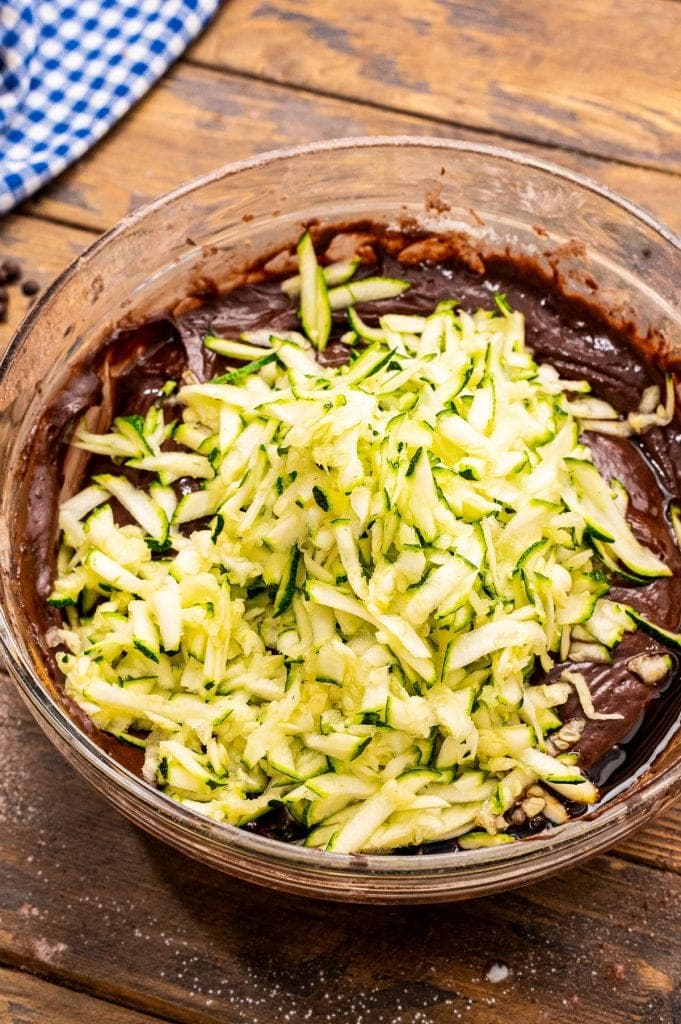 Adding zucchini to chocolate zucchini bread batter